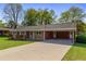 Beautiful single-story home boasting a well-kept lawn and a convenient carport at 3031 Walker Dr, Marietta, GA 30062