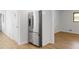 Functional kitchen space with modern stainless steel refrigerator and hardwood floors at 3031 Walker Dr, Marietta, GA 30062