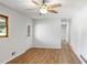 Bright living room featuring hardwood floors, a ceiling fan, and large windows at 3031 Walker Dr, Marietta, GA 30062