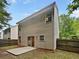 View of backyard patio with rear view of the home at 6240 Shenfield Ln, Union City, GA 30291