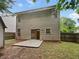 View of backyard patio and the home's rear elevation at 6240 Shenfield Ln, Union City, GA 30291
