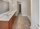 This bathroom has a double vanity, updated vinyl floors, and a large mirror at 6240 Shenfield Ln, Union City, GA 30291