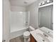 This bathroom has a shower and tub combination plus a decorative light fixture and sink at 6240 Shenfield Ln, Union City, GA 30291