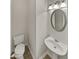 This half bath includes a sink with pedestal and decorative light fixture at 6240 Shenfield Ln, Union City, GA 30291