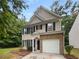 Inviting two-story home featuring classic architecture and a well-maintained front yard at 6240 Shenfield Ln, Union City, GA 30291