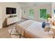Bright main bedroom with large windows, dresser, and neutral tones, offering a serene retreat at 6240 Shenfield Ln, Union City, GA 30291