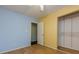 Bedroom features a closet, yellow and blue walls, and a window at 1249 Riva Ridge Dr, Norcross, GA 30093