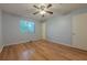 Bedroom with hardwood floors, large window and closet at 1249 Riva Ridge Dr, Norcross, GA 30093