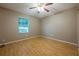 Spacious bedroom with a large window and hardwood flooring at 1249 Riva Ridge Dr, Norcross, GA 30093