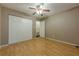 Bedroom with hardwood floors, a closet, and a view to the bathroom at 1249 Riva Ridge Dr, Norcross, GA 30093