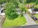 This single-story home features a well-kept lawn, driveway, and is shaded by mature trees at 1249 Riva Ridge Dr, Norcross, GA 30093