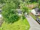 This single-story home features a well-kept lawn, driveway, and is shaded by mature trees at 1249 Riva Ridge Dr, Norcross, GA 30093