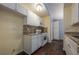 Well-lit kitchen with granite countertops, white cabinets, and modern appliances at 1249 Riva Ridge Dr, Norcross, GA 30093