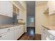 Bright kitchen features white cabinets, granite countertops, and stainless steel appliances at 1249 Riva Ridge Dr, Norcross, GA 30093