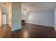 Open-concept living room with hardwood floors and a stone fireplace, and a breakfast bar at 1249 Riva Ridge Dr, Norcross, GA 30093
