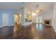 Open-concept living room with hardwood floors, stone fireplace and view to the kitchen at 1249 Riva Ridge Dr, Norcross, GA 30093