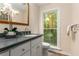 Bright bathroom features a large window and a stylish vanity at 2880 Foothill Trl, Marietta, GA 30066