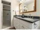 Modern bathroom featuring a double sink vanity and a glass-enclosed shower at 2880 Foothill Trl, Marietta, GA 30066