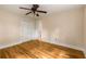 Bright bedroom featuring hardwood floors, a ceiling fan and double door closet at 2880 Foothill Trl, Marietta, GA 30066