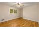 Cozy bedroom offers hardwood floors, a ceiling fan, and natural light at 2880 Foothill Trl, Marietta, GA 30066