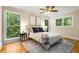 Bright bedroom boasts ample natural light and hardwood floors at 2880 Foothill Trl, Marietta, GA 30066