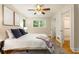 Comfortable bedroom features natural light, ceiling fan, and closet access at 2880 Foothill Trl, Marietta, GA 30066