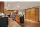 Spacious kitchen featuring wooden cabinets, granite countertops, stainless steel appliances, and an island at 2880 Foothill Trl, Marietta, GA 30066