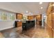 Open kitchen offers an island, stainless appliances, lots of cabinets, and access to the rest of the home at 2880 Foothill Trl, Marietta, GA 30066
