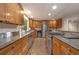 Updated kitchen with stainless steel appliances, granite countertops, and custom cabinetry at 2880 Foothill Trl, Marietta, GA 30066