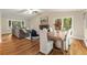 Open-concept living area with a dining table, hardwood floors, and a seamless flow for entertaining at 2880 Foothill Trl, Marietta, GA 30066