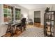 Bright home office with large windows, hardwood floors, and a view of the wooded backyard at 2880 Foothill Trl, Marietta, GA 30066