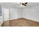 An open bedroom features updated floors, ceiling fan, and neutral walls at 5012 Galbraith Cir, Stone Mountain, GA 30088