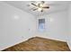 Bedroom with hardwood floors, a ceiling fan, natural light, and neutral paint at 5012 Galbraith Cir, Stone Mountain, GA 30088