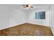 Bedroom with hardwood floors, neutral walls, and a large window at 5012 Galbraith Cir, Stone Mountain, GA 30088