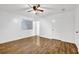 Bedroom featuring wood-look floors, natural light, a ceiling fan, and neutral paint at 5012 Galbraith Cir, Stone Mountain, GA 30088