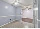 Dining area featuring neutral paint, ceiling fan, and decorative flooring at 5012 Galbraith Cir, Stone Mountain, GA 30088