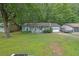 Charming single-story home with light blue siding and a well-maintained front yard at 5012 Galbraith Cir, Stone Mountain, GA 30088