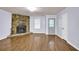 Cozy living room with a stone fireplace and light-colored walls and hardwood floors at 5012 Galbraith Cir, Stone Mountain, GA 30088