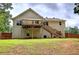 Back of house featuring a wooden deck, stairs, and fenced-in backyard perfect for outdoor activities at 121 Paradise Circle, Douglasville, GA 30134