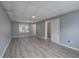 Spacious basement with large window for light and gray laminate floors at 121 Paradise Circle, Douglasville, GA 30134