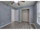 This bedroom includes a large closet, laminate floors, and neutral paint at 121 Paradise Circle, Douglasville, GA 30134