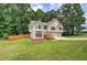 Charming split-level home featuring stone accents, wood shutters, and a two-car garage at 121 Paradise Circle, Douglasville, GA 30134