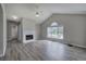 Spacious living room boasting cathedral ceilings, large windows, and modern gray flooring at 121 Paradise Circle, Douglasville, GA 30134