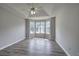 Main bedroom featuring vaulted ceiling, ceiling fan and a large bay window at 121 Paradise Circle, Douglasville, GA 30134