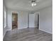 Main bedroom with gray walls, hardwood floors and two entry doors at 121 Paradise Circle, Douglasville, GA 30134