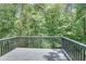 Spacious back deck with a wooded view provides a serene outdoor space at 3706 Londonderry Ct, Lithonia, GA 30038