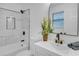 Stylish bathroom with a marble tiled shower and modern fixtures at 3706 Londonderry Ct, Lithonia, GA 30038