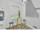 Bright breakfast nook with a charming table, stylish stools, and contemporary lighting at 3706 Londonderry Ct, Lithonia, GA 30038