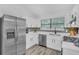 Modern kitchen with stainless steel appliances, ample counter space, and stylish finishes at 3706 Londonderry Ct, Lithonia, GA 30038