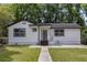 Charming bungalow with a well-maintained lawn and inviting walkway to the front door at 856 Bridgewater Sw St, Atlanta, GA 30310